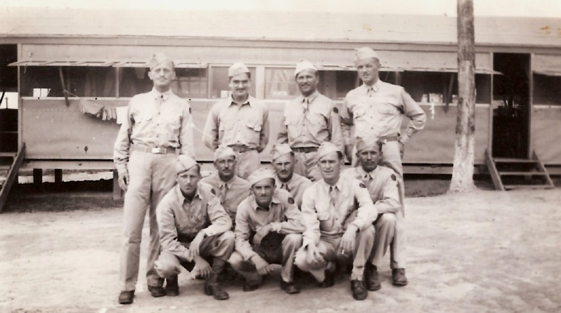 Posing for photo outside their Barracks.